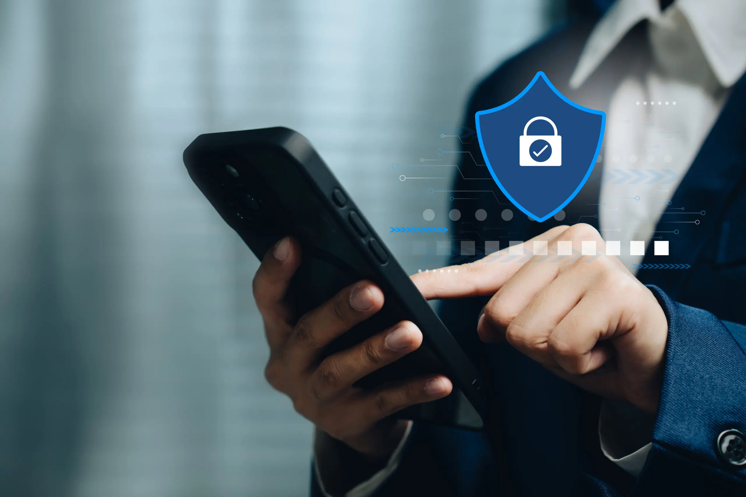 Cybersecurity concept with businessman using smartphone showing digital shield symbol for data privacy protection online safe