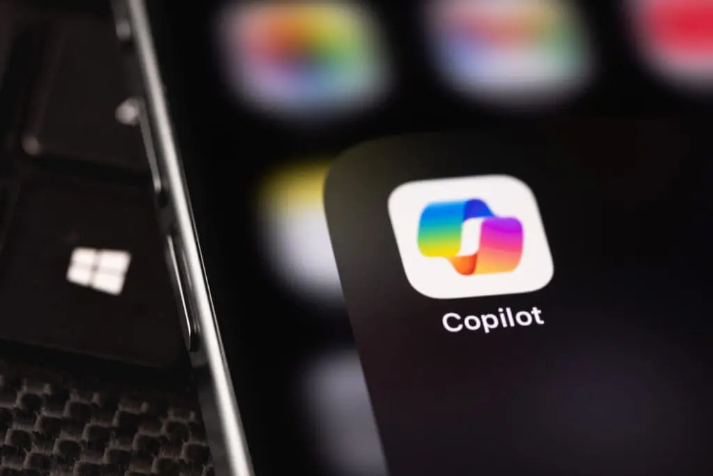 Microsoft Copilot mobile icon app on a screen smartphone iPhone closeup. Microsoft Copilot is an artificial intelligence assi