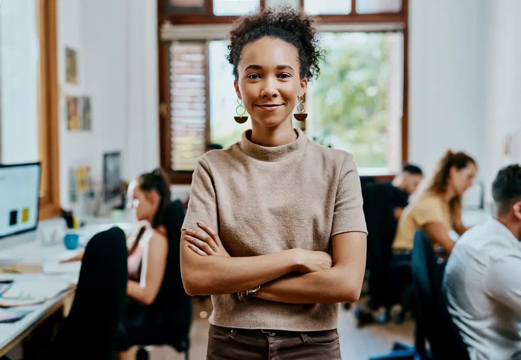 Woman, smile and portrait in creative office for startup, artist and happy for small business agency. Manager, workshop and a